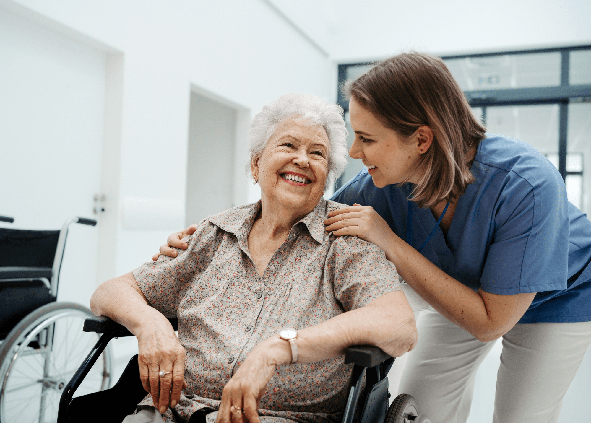 Circle Support Care Worker Assisting Elderly Woman in Wheelchair